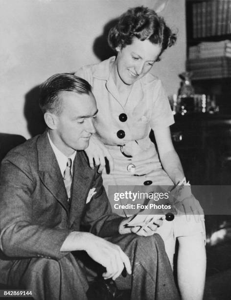 Australian tennis player Nell Hall Hopman and her husband Harry Hopman read congratulatory telegrams at their home in Melbourne, Australia, 24th...