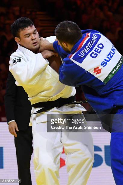 Aaron Wolf of Japan and Varlam Liparteliani of Georgia compete in the Men's -100kg final during day six of the World Judo Championships at the Laszlo...