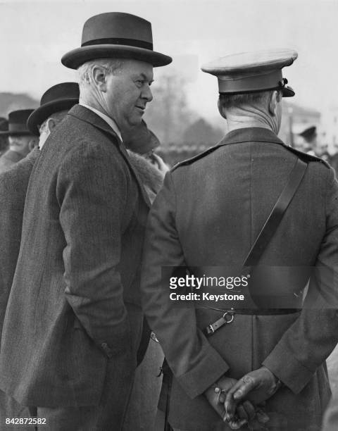 Sir Thomas Inskip, 1st Viscount Caldecote watches a march-past at the Church Parade at Sandhurst College, UK, 4th December 1938. Leslie Hore-Belisha...