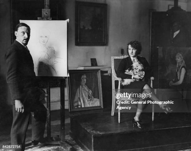 Scottish painter William Oliphant Hutchison works on a portrait of dancer Mildred Melrose, circa 1927.