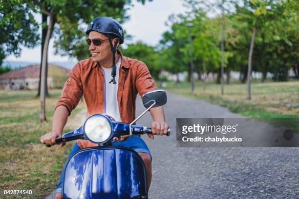 stilig man rider en vintage skoter - man with scooter bildbanksfoton och bilder