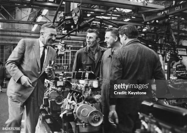 Allen Barke chats to workers in the assembly shop, the day after taking over as Chief Executive of Ford UK, 2nd May 1963. He takes over the role from...