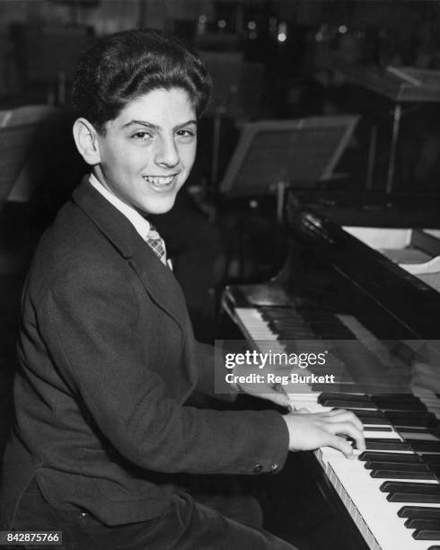 Thirteen-year-old pianist Daniel Barenboim rehearses at the Royal Festival Hall in London, for a concert with the Royal Philharmonic Orchestra, 13th...