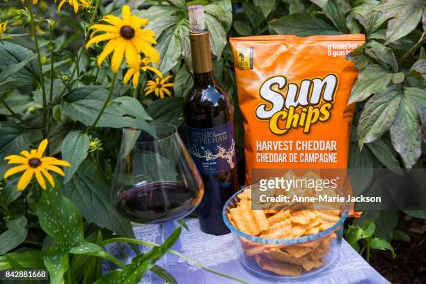 August 9, 2017 - 2016 Henry of Pelham Baco Noir, Old Vines, VQA Ontario and Harvest Cheddar Sun Chips. For column by Carolyn Hammond on summer wine...