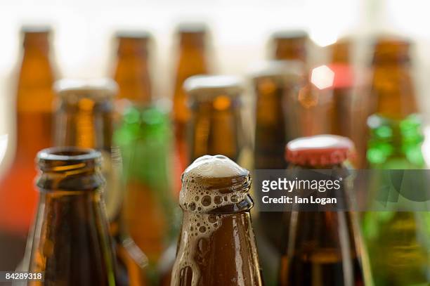 freshly opened beer - overflowing beer stock pictures, royalty-free photos & images