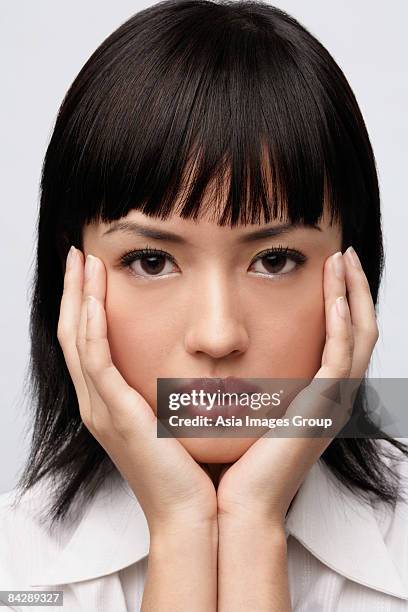 portrait of woman with hands on face - double facepalm stock pictures, royalty-free photos & images