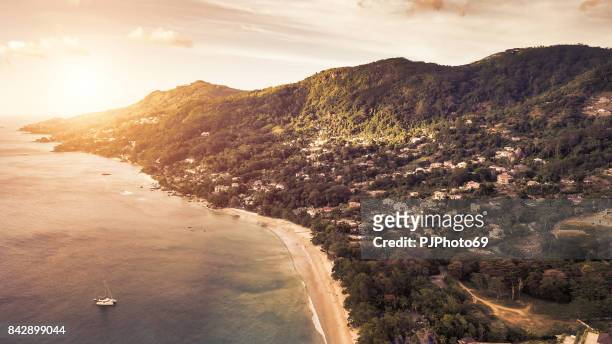 aerial view of sunset in baie beau vallon - mahe - seychelles - pjphoto69 stock pictures, royalty-free photos & images