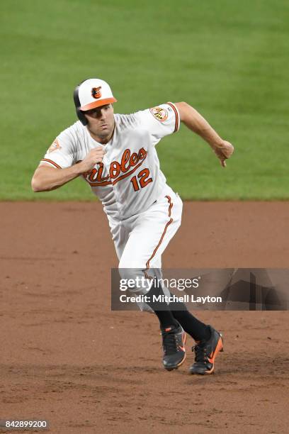 Seth Smith of the Baltimore Orioles runs to third base during a baseball game against the Seattle Mariners at Oriole Park at Camden Yards on August...