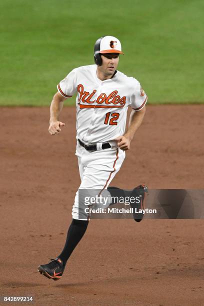 Seth Smith of the Baltimore Orioles runs to third base during a baseball game against the Seattle Mariners at Oriole Park at Camden Yards on August...