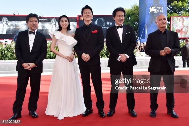 Hirokazu Koreeda, Suzu Hirose, Koji Yakusho, Masaharu Fukuyama and Ludovico Einaudi walk the red carpet ahead of the 'The Third Murder ' screening...