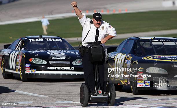 Actor and comedian Kevin James celebrates while racing NASCAR stock cars with his Segway to promote the release of his new movie, "Paul Blart: Mall...