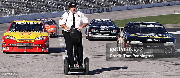 Actor and comedian Kevin James races NASCAR stock cars with his Segway to promote the release of his new movie "Paul Blart: Mall Cop" at Texas Motor...