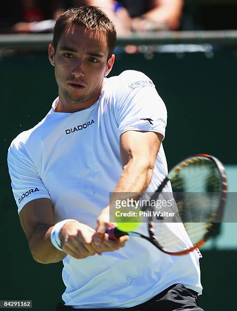 Viktor Troicki of Serbia plays a backhand against Juan Martin Del Potro of Argentina during day four of the Heineken Open at ASB Tennis Centre on...