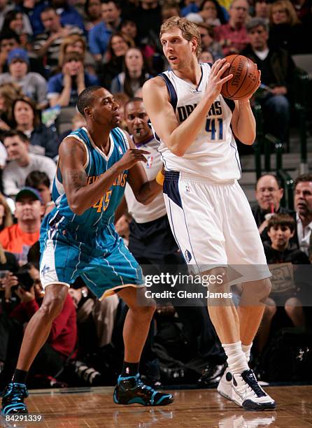 Dirk Nowitzki of the Dallas Mavericks posts up against Rasual Butler of the New Orleans Hornets at the American Airlines Center January 14, 2009 in...