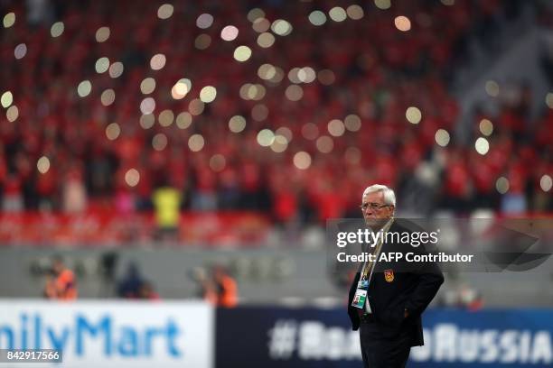 China's Italian Head Coach Marcello Lippi looks on during the FIFA World Cup 2018 qualification football match between Qatar and China at the Khalifa...