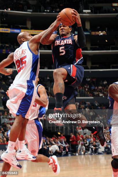 Josh Smith of the Atlanta Hawks goes to the basket against Mardy Collins of the Los Angeles Clippers at Staples Center on January 14, 2009 in Los...