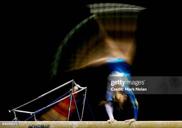 Athletes go through their routines on the uneven bars and the long beam during the Artistic Gymnastics on day two of the Australian Youth Olympic...