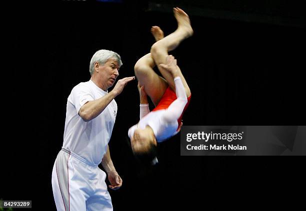 The Japanese coach assists an athlete during a routine during the Artistic Gymnastics on day two of the Australian Youth Olympic Festival at the...