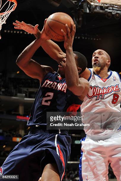 Joe Johnson of the Atlanta Hawks goes to the basket against Brian Skinner of the Los Angeles Clippers at Staples Center on January 14, 2009 in Los...