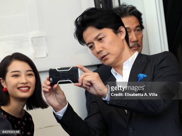 Hirose Suzu and Yakusho Koji attend the 'The Third Murder ' photocall during the 74th Venice Film Festival on September 5, 2017 in Venice, Italy.