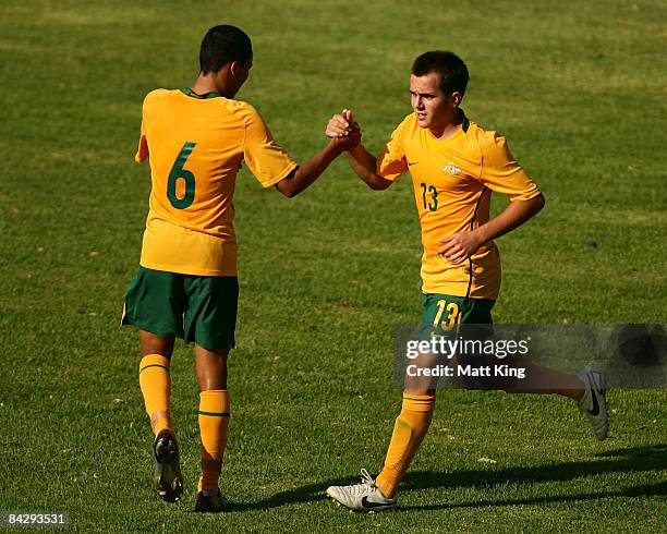 Steven Lustica of Australia celebrates with Kearyn Baccus after scoring the first goal during the football match between Australia and China during...