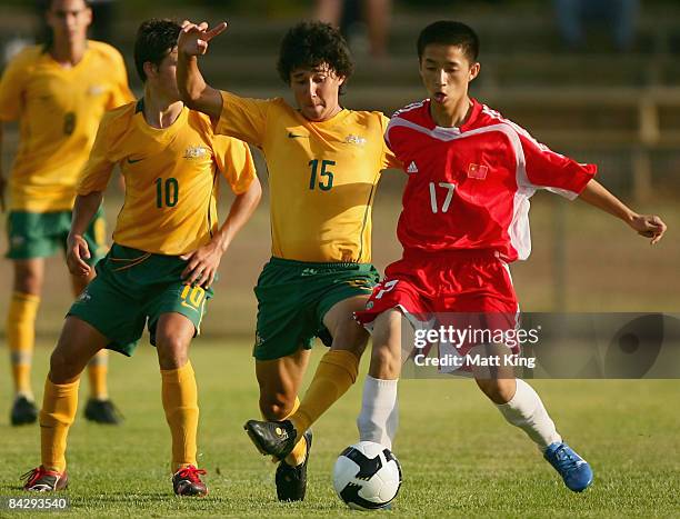 Koh Satake of Australia and Ma Si Yuan of China challenge for the ball during the football match between Australia and China during day two of the...