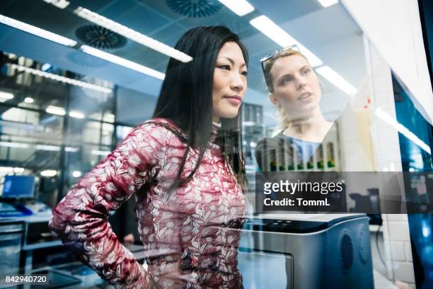 female engineers discussing - intelligence stock pictures, royalty-free photos & images