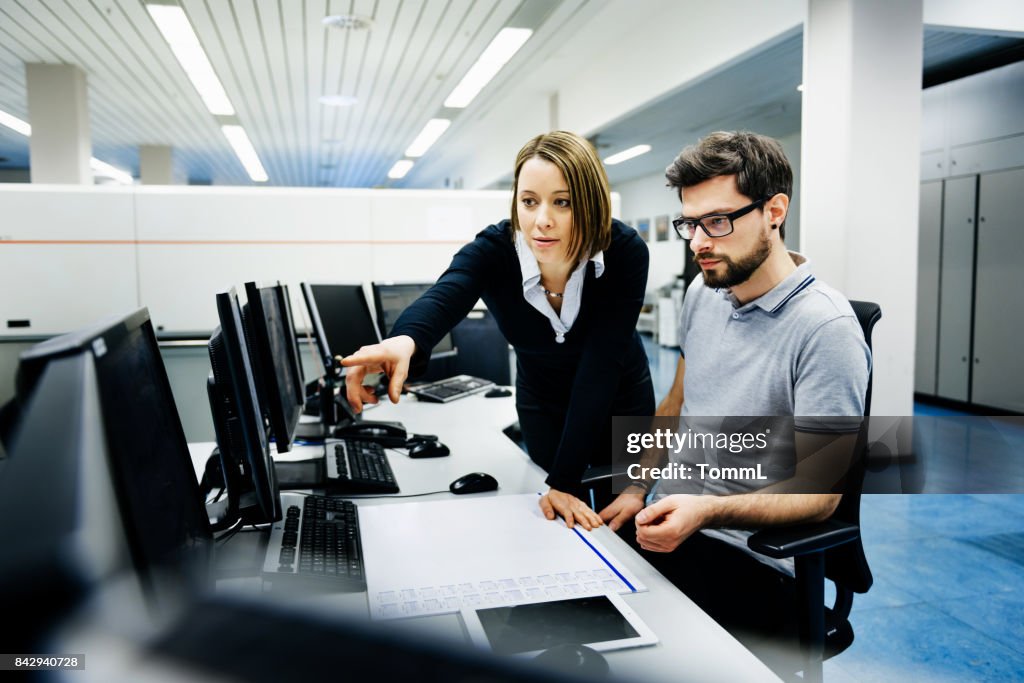 It professionals in control room