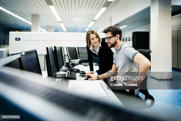 it professionals in control room - control centre stock pictures, royalty-free photos & images