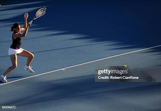 Virginie Razzano of France returns a shot during her singles semi final against Petra Kvitova of the Czech Republic on day seven of the Moorilla...