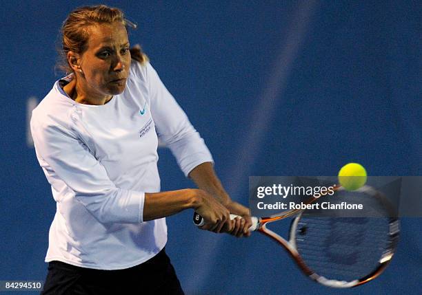 Barbora Zahlavova Strycova of the Czech Republic returns a shot to Gisela Dulko of Argentina and Flavia Pennetta of Italy during the semi finals...