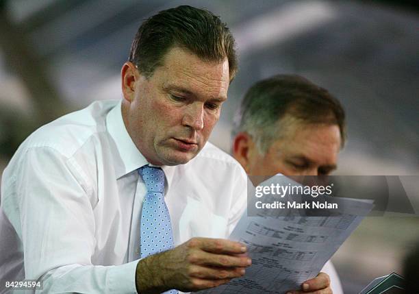 Premier Nathan Rees looks over the program during the Track Cycling on day two of the Australian Youth Olympic Festival at the Dunc Gray Velodrome on...