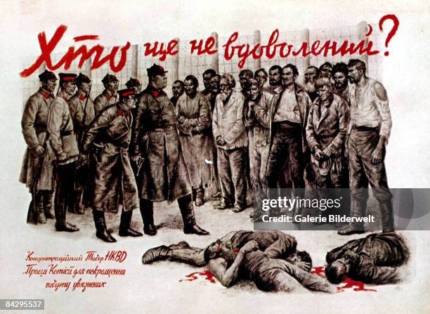 German Anti-NKVD propaganda poster from the Ukraine, circa 1942. Officers of the NKVD, the Soviet Secret Service stand over the bloodied corpses of...