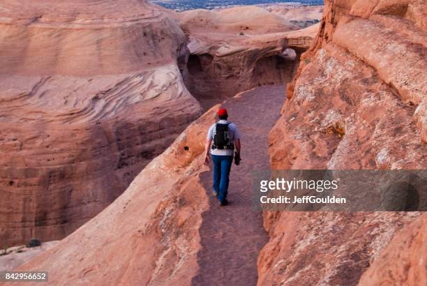 hiking the delicate arch ledge trail - navajo sandstone formations stock pictures, royalty-free photos & images