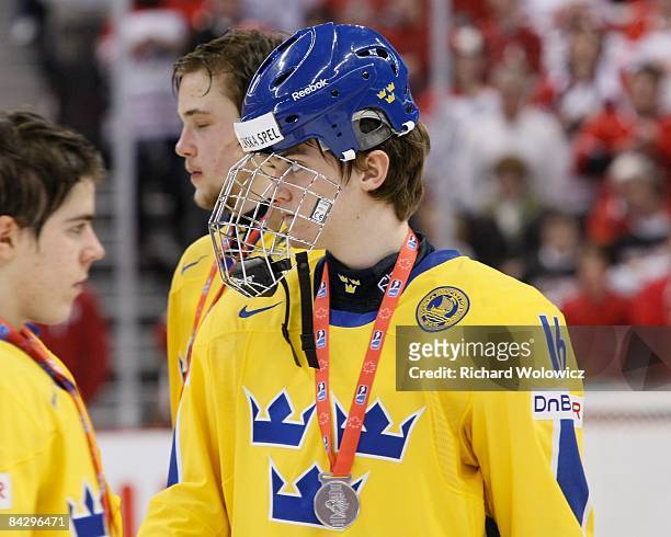 Tim Erixon of Team Sweden watches post game ceremonies after being defeated by Team Canada at the Gold Medal Game of the IIHF World Junior...