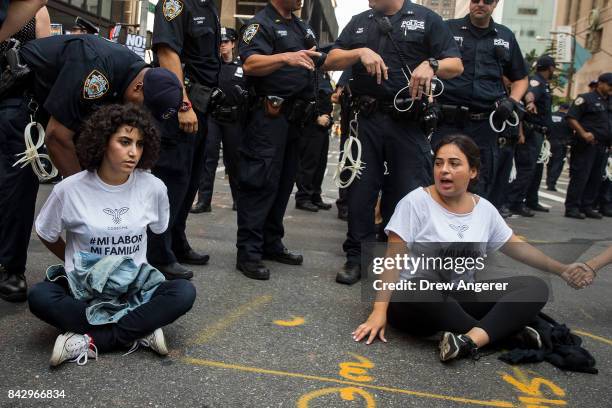 Immigration activists protesting the Trump administration's decision on the Deferred Action for Childhood Arrivals are arrested by New York City...