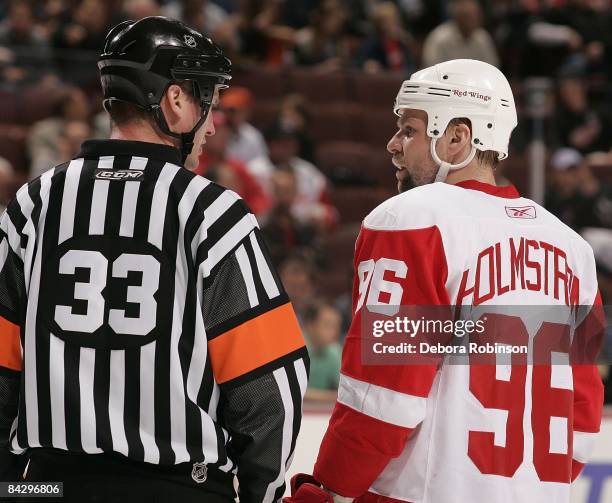 Tomas Holmstrom of the Detroit Red Wings has a conversation with referee Kevin Pollock during the game against the Anaheim Ducks during the game on...
