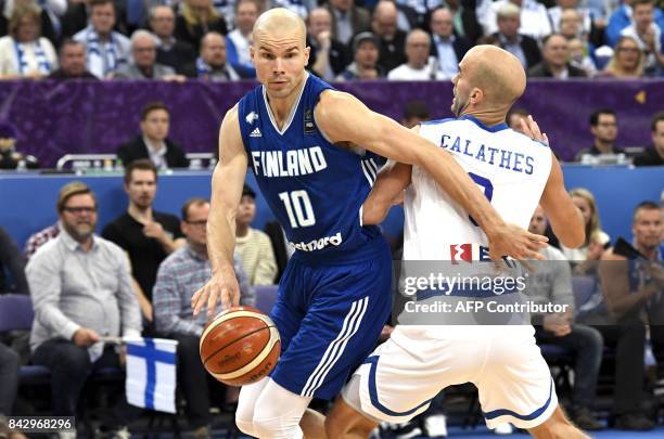 Tuukka Kotti of Finland and Nick Calathes of Greece vie for the ball during the basketball European Championships Eurobasket 2017 qualification round...