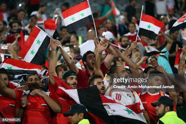 Fans of Syria celebrate during FIFA 2018 World Cup Qualifier match between Iran v Syria on September 5, 2017 in Tehran, Iran.