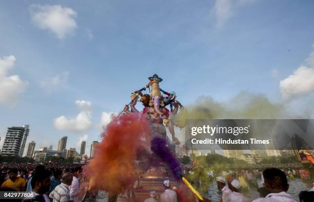 Devotees prepare to immerse idols of elephant-headed Hindu God Ganesha in the Arabian Sea, marking the end of the 10-day long Ganesh Chaturthi...