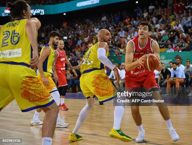 Vlad Moldoveanu of Romania vies with Rosco Allen of Hungary during a Group C basketball match at the FIBA Eurobasket 2017 in Cluj Napoca, Romania...