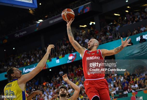 Catalin Baciu of Romania vies with David Vojvoda of Hungary during a Group C basketball match at the FIBA Eurobasket 2017 in Cluj Napoca, Romania...