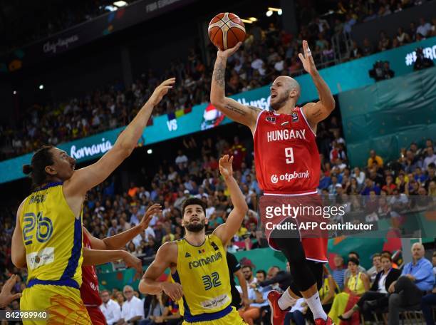 Catalin Baciu of Romania vies with David Vojvoda of Hungary during a Group C basketball match at the FIBA Eurobasket 2017 in Cluj Napoca, Romania...