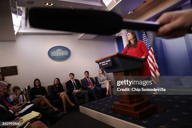 White House Press Secretary Sarah Huckabee Sanders calls on reporters during the daily news conference in the Brady Press Briefing Room at the White...