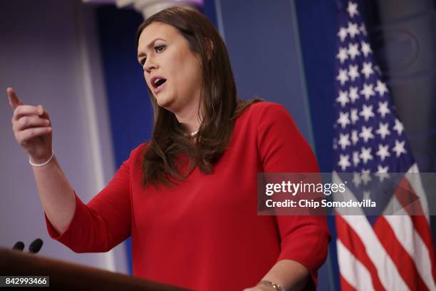 White House Press Secretary Sarah Huckabee Sanders calls on reporters during the daily news conference in the Brady Press Briefing Room at the White...