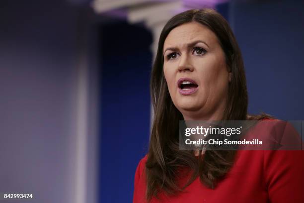 White House Press Secretary Sarah Huckabee Sanders calls on reporters during the daily news conference in the Brady Press Briefing Room at the White...