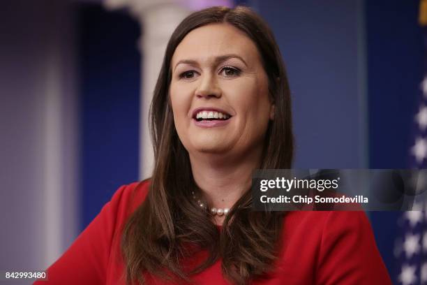 White House Press Secretary Sarah Huckabee Sanders calls on reporters during the daily news conference in the Brady Press Briefing Room at the White...