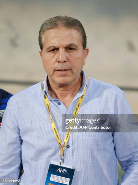 Syria's coach Ayman Hakeem attends the FIFA World Cup 2018 qualification football match between Syria and Iran at the Azadi Stadium in Tehran on...