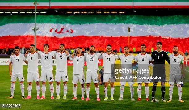 Iranian players pose prior to the FIFA World Cup 2018 qualification football match between Syria and Iran at the Azadi Stadium in Tehran on September...