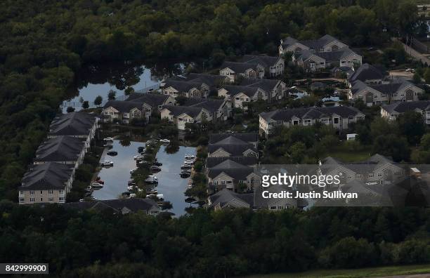 Housing development sits in floodwaters on September 5, 2017 in Houston, Texas. Over a week after Hurricane Harvey hit Southern Texas, residents are...